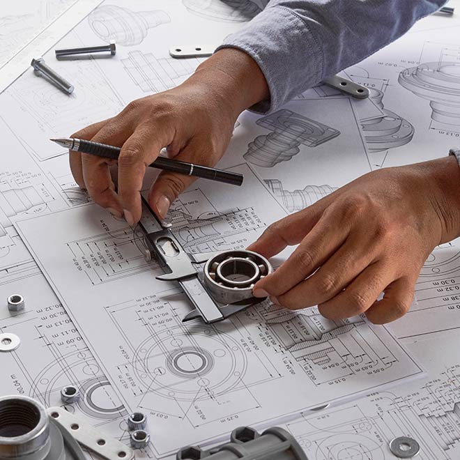 Person working on mechanical engineering tasks