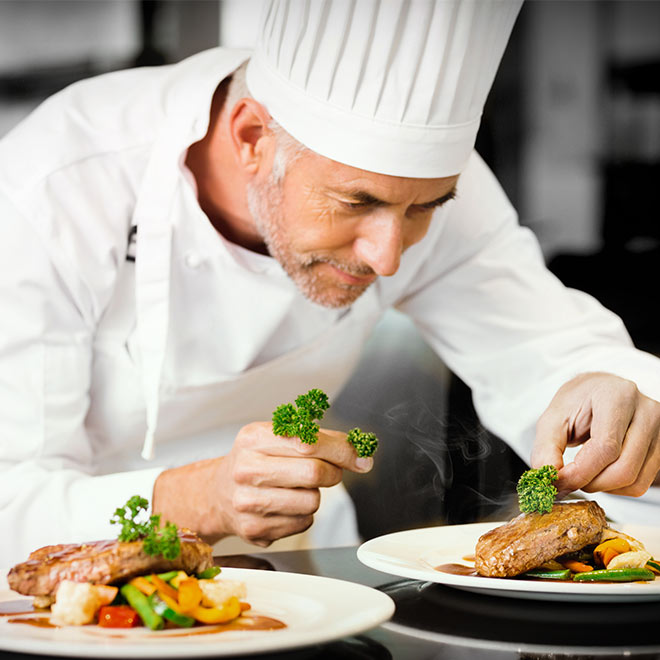 Chef plating a dish